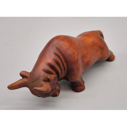 26 - Japanese hand carved boxwood netsuke in the form of a Bull. Signed. [7cm length]