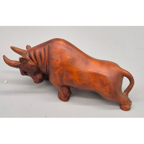 26 - Japanese hand carved boxwood netsuke in the form of a Bull. Signed. [7cm length]