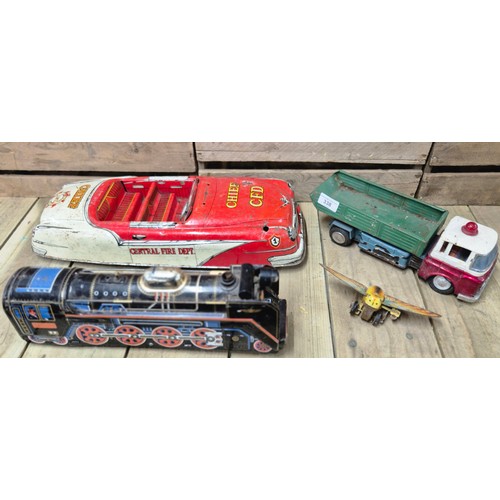 338 - Four tin plate model toys; Butterfly, Chief C.F.D. Large car model, Truck model and Japanese made T.... 