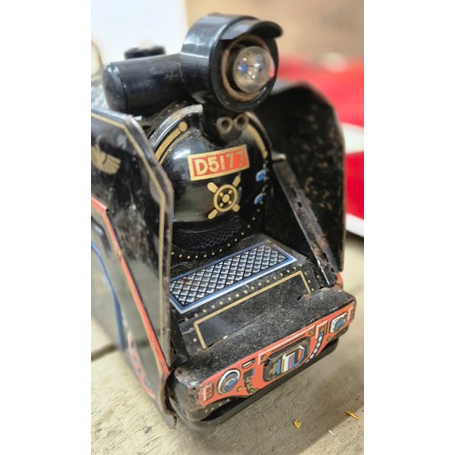 338 - Four tin plate model toys; Butterfly, Chief C.F.D. Large car model, Truck model and Japanese made T.... 