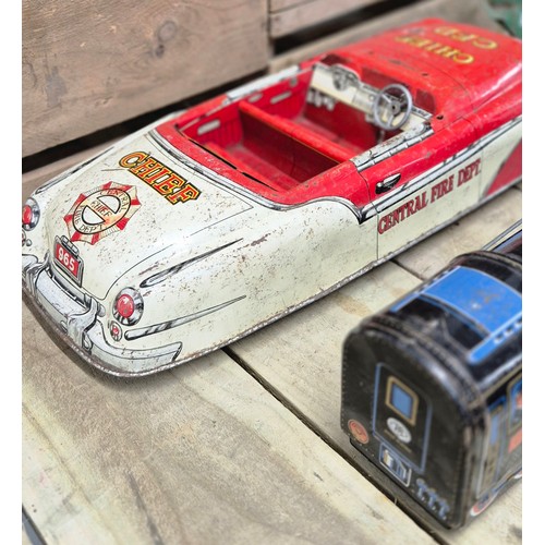 338 - Four tin plate model toys; Butterfly, Chief C.F.D. Large car model, Truck model and Japanese made T.... 