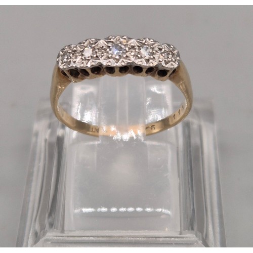 42 - 1920's 9ct yellow gold and Platinum diamond ring. Fitted with five varying sized round cut diamonds.... 