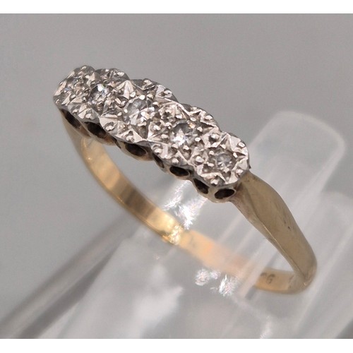 42 - 1920's 9ct yellow gold and Platinum diamond ring. Fitted with five varying sized round cut diamonds.... 