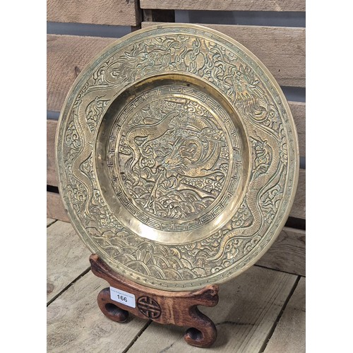 166 - Heavy antique Chinese Gilt brass/ bronze dragon design shallow bowl with wooden display stand. [33cm... 