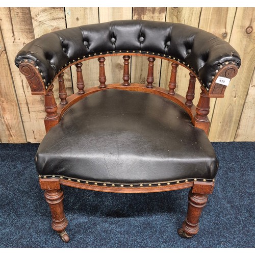 439 - 19th century oak framed elbow chair, Button back leather upholstery. Raised on turned legs and havin... 