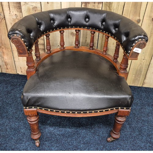 439 - 19th century oak framed elbow chair, Button back leather upholstery. Raised on turned legs and havin... 