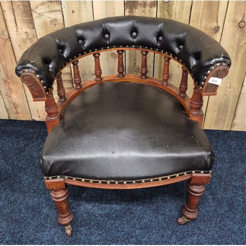 439 - 19th century oak framed elbow chair, Button back leather upholstery. Raised on turned legs and havin... 