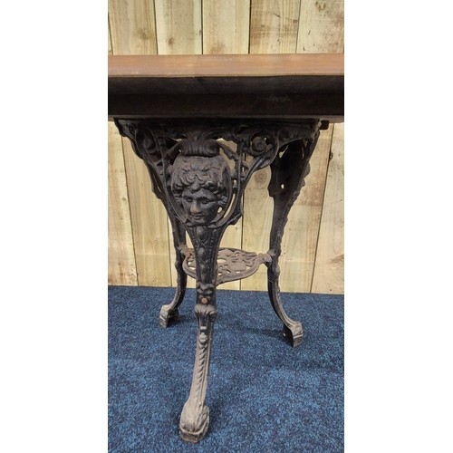 425 - Cast Iron base garden table. Square form solid wood top section. [69.5x75cm]