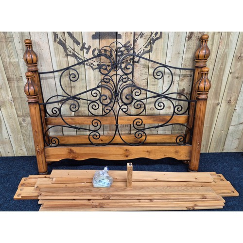 440 - Antique style Pine King size bed frame with wrought iron supports.