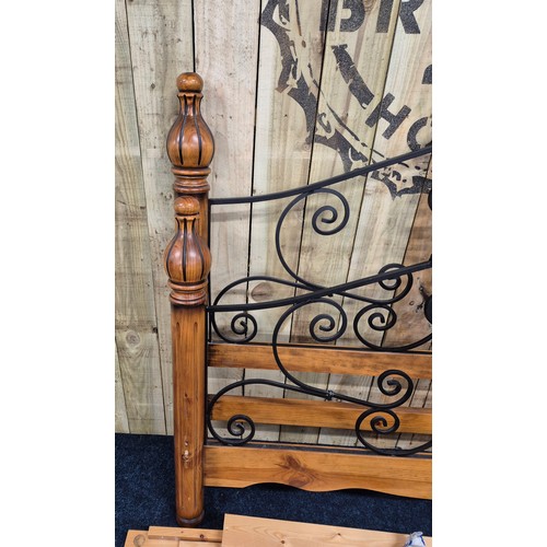 440 - Antique style Pine King size bed frame with wrought iron supports.