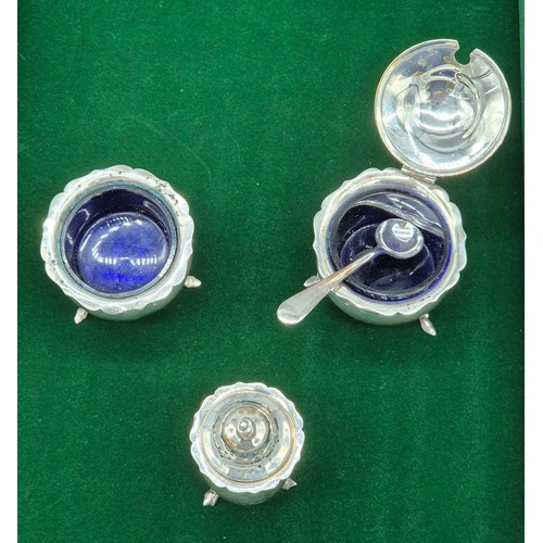 23 - Three piece Birmingham silver hallmarked condiment set. Two with blue liners and plated condiment sp... 