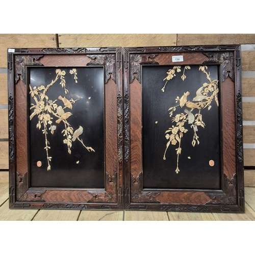 156 - A Pair of Japanese Meiji period wall hanging panels; Both depicting birds perched on floral branches... 