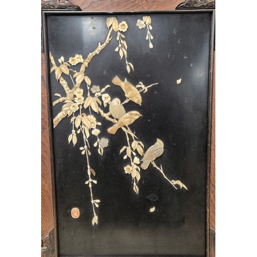 156 - A Pair of Japanese Meiji period wall hanging panels; Both depicting birds perched on floral branches... 