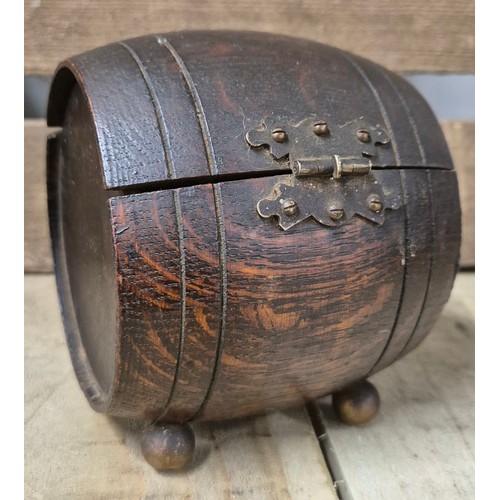 257 - A Pair of heavy African bust book ends, antique barrel tea caddy containing vintage stamps together ... 