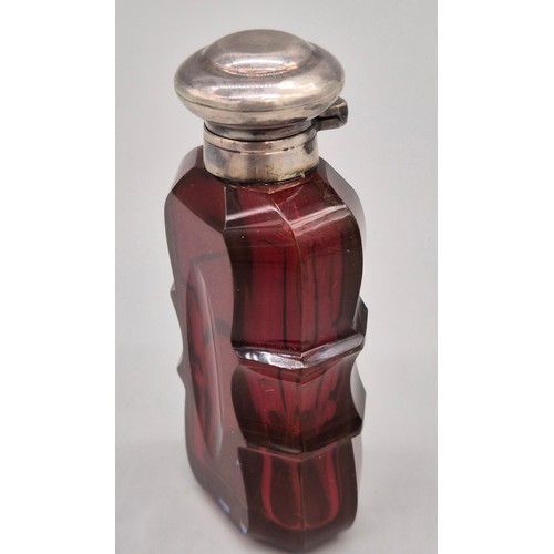 48 - Victorian Ruby facet cut and silver perfume bottle- Stopper present. [8cm high]