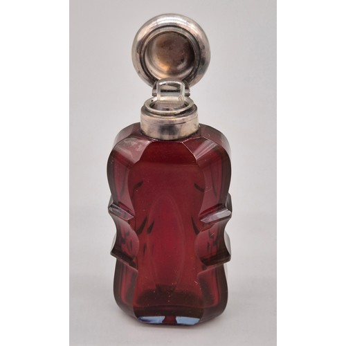 48 - Victorian Ruby facet cut and silver perfume bottle- Stopper present. [8cm high]