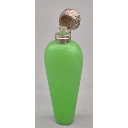 54 - 1920's Green glass and silver top perfume bottle- possibly Uranium glass. Stopper still present. [10... 