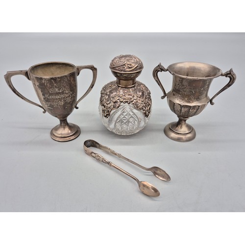 44 - Various silver hallmarked items; All Birmingham silver hallmarked- Two trophies, Sugar tongs and orn... 