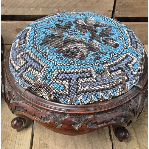 175 - A Pair of 19th century Needlework top stools. Raised hand carved wooden bases.