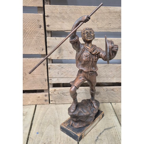 256 - Heavy cast metal bronze scout figure sculpture- raised on a wooden plinth and having a presentation ... 