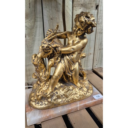 128 - Early 20th century Gilt painted Terracotta cherub & Ram figural table lamp raised on a marble base [... 