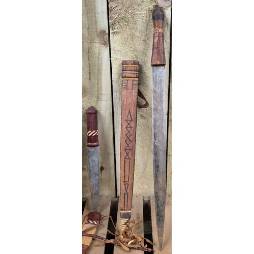 141 - A Selection of Three tribal leather bound daggers and sheaths.