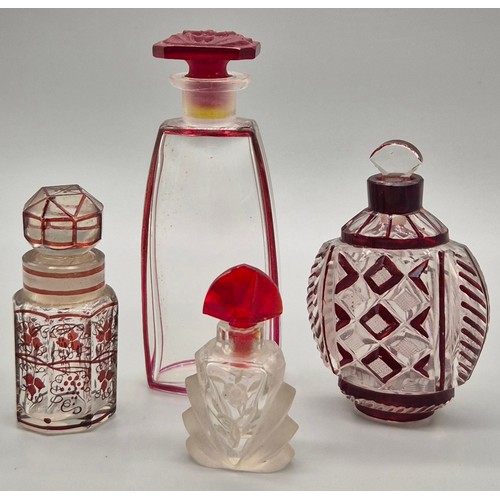 40 - A Lot of four antique and vintage cut glass perfume bottles; Bohemian Ruby vine design bottle & Rais... 