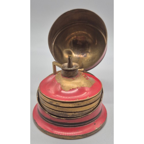 147 - Ges Gesch red enamel and brass lidded burner with three glass dishes. [7cm high]