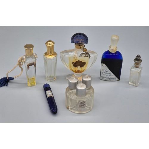 56 - A Collection of vintage perfume bottles; Baccarat Guerlain Paris scent bottle, Bourjois Blue scent b... 