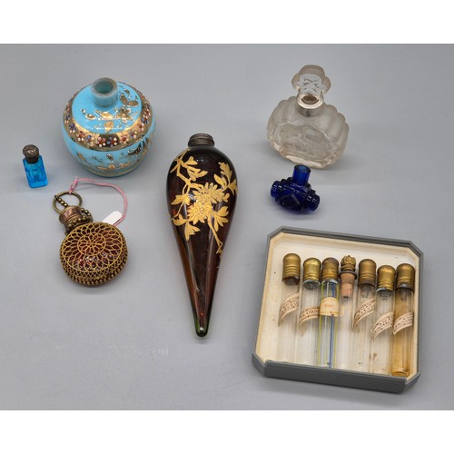 46 - A Selection of antique and vintage perfume bottles; French Amami perfume bottles, Moser blue glass a... 