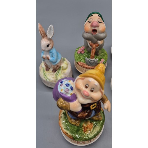 353 - Schmid collectable music figures; Snow White and the seven dwarfs and Beatrix potter