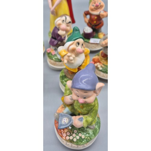 353 - Schmid collectable music figures; Snow White and the seven dwarfs and Beatrix potter