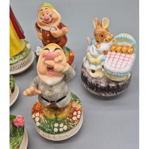 353 - Schmid collectable music figures; Snow White and the seven dwarfs and Beatrix potter