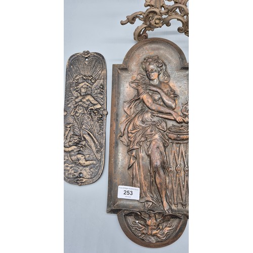 253 - Various collectables; Pair of cast iron/ metal figure plaques, Two cast iron reproduction door facer... 