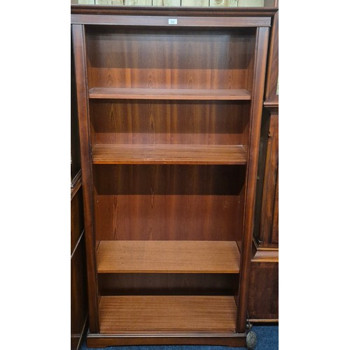 214 - Reproduction Mahogany four shelved book case [188.5x97x33.5cm]