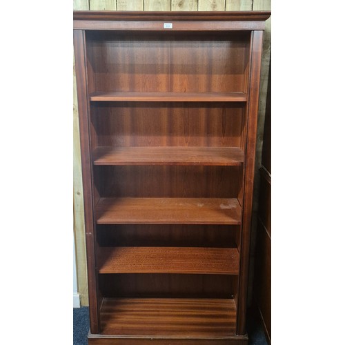 213 - Reproduction Mahogany four shelved book case [188.5x97x33.5cm]