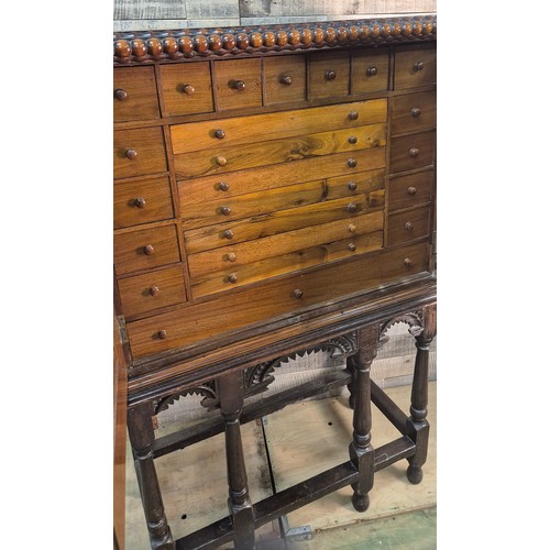 175 - 19th century Mahogany collectors cabinet. Carved bobble trim top, two doors opening to reveal a coll... 