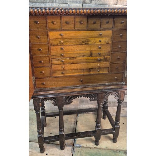 175 - 19th century Mahogany collectors cabinet. Carved bobble trim top, two doors opening to reveal a coll... 