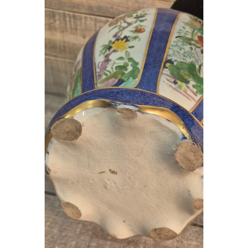 186 - A Large 19th century Chinese temple jar with lid. Gilt painted dog of foo seated to the top of the l... 