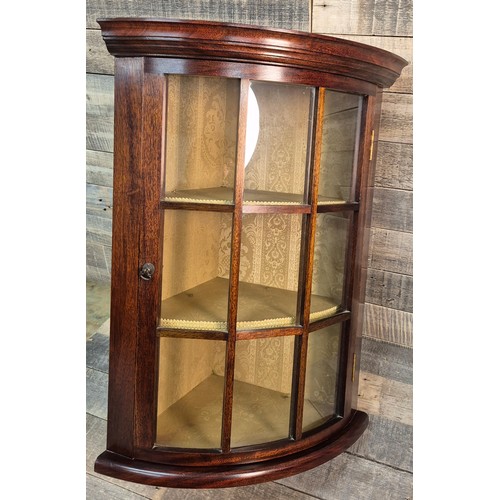 203 - Reproduction of a Victorian Mahogany wall corner cabinet. Fitted with interior shelves and gold mate... 