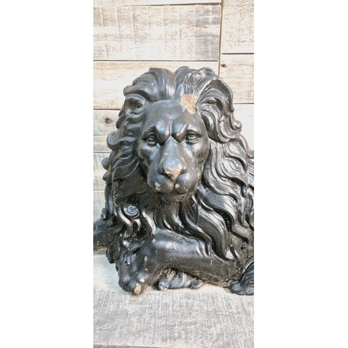 193 - 19th century cast metal resting lion door stop sculpture. [35x70x12cm]