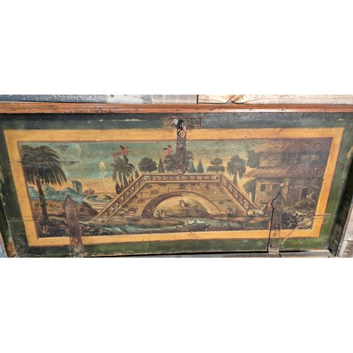 184 - 19th century travel trunk; fitted with heavy wrought iron handles. Painted panel to the interior of ... 