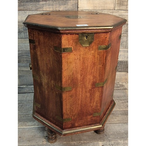 172 - Reproduction octagonal Mahogany and brass bound campaign table box. Brass handles to the sides. Rais... 