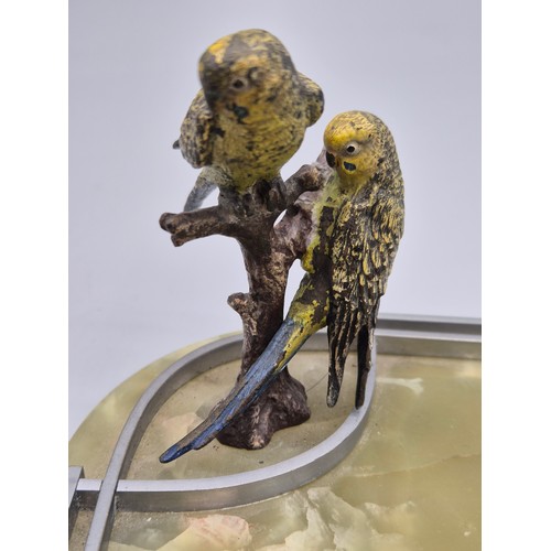 91 - Art Deco cold painted bronze sculpture of two parrots raised on a chrome and onyx base. [10cm high]