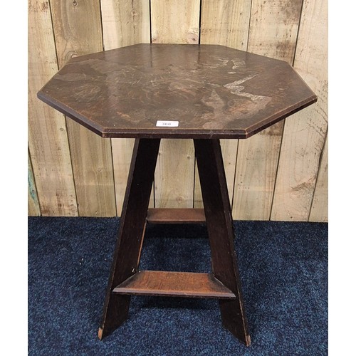 341 - Liberty & Co oak Octagonal window table. Raised on four outswept legs. [70x61x61cm]