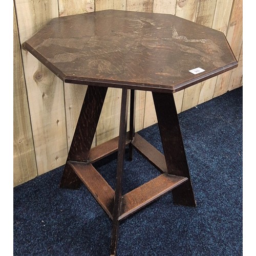 341 - Liberty & Co oak Octagonal window table. Raised on four outswept legs. [70x61x61cm]