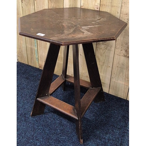 341 - Liberty & Co oak Octagonal window table. Raised on four outswept legs. [70x61x61cm]