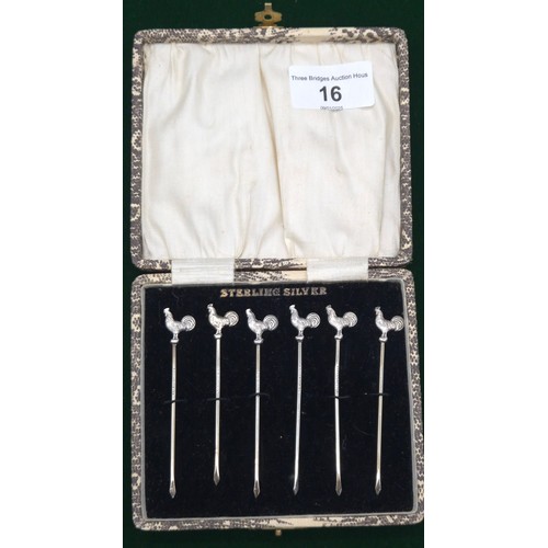 16 - Boxed set of six Sterling silver tooth picks details with cockerel finials.