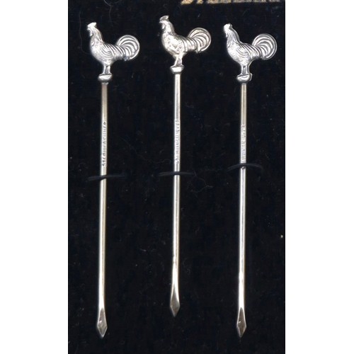 16 - Boxed set of six Sterling silver tooth picks details with cockerel finials.