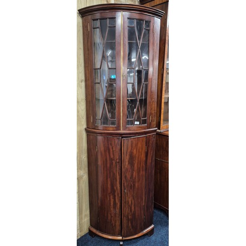 342 - 19th century Mahogany bow front corner cabinet. Top section having bow glass doors. brass trim and c... 